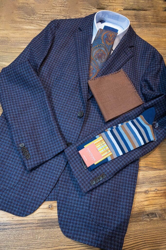 Blue checked jacket with tie, pocket handkerchief, and matching socks
