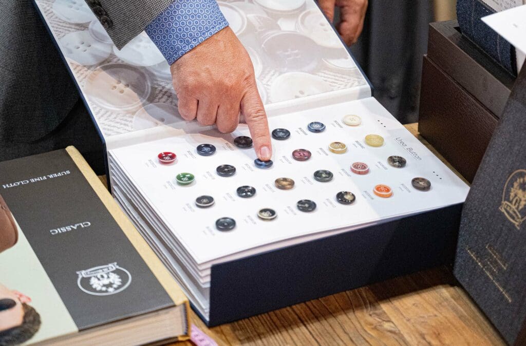 Pointing to a lookbook of premium button choices